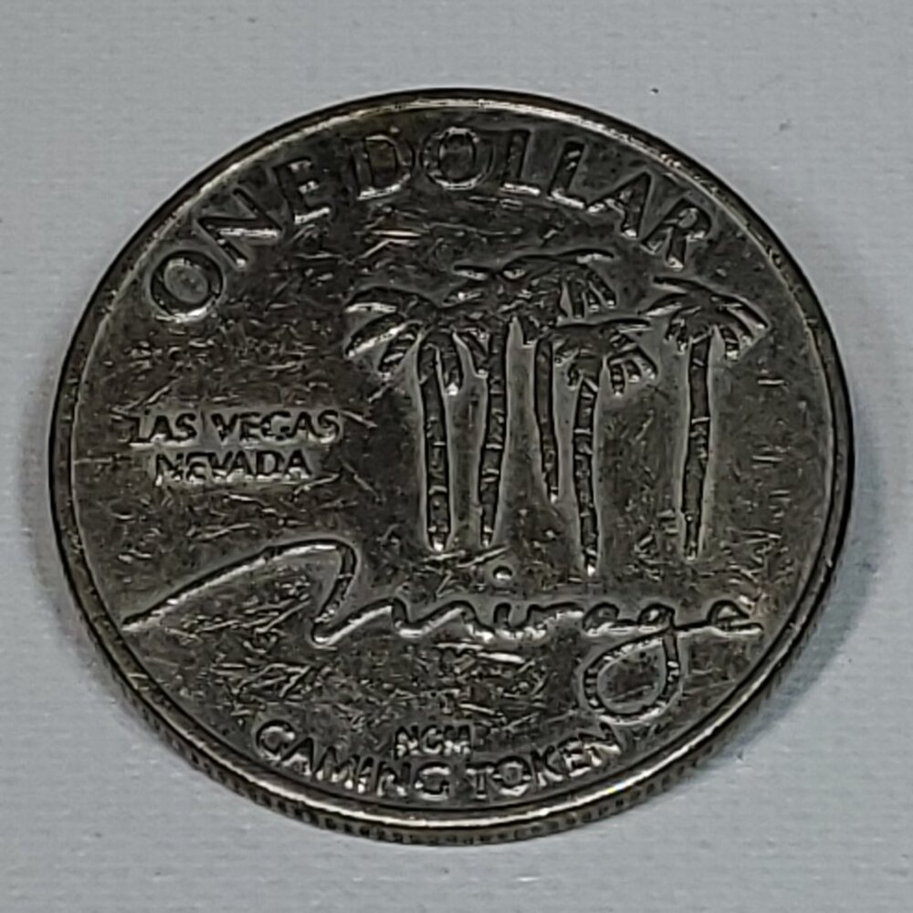 VINTAGE MIRAGE CASINO SILVER ONE DOLLAR GAMING TOKEN 1989 BY NEVADA COIN MINTING